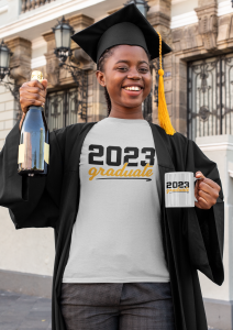 t shirt mockup of a happy young woman holding an 11 oz mug and wearing a graduation gown 32571
